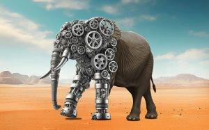 Elefant aus Zahnrädern und Mechanik in der Wüste – futuristische Kunst zwischen Natur und Technik.